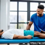 스포츠재활사와 물리치료센터 협력 사례 - A male athlete in his early 20s, wearing modest basketball shorts and a t-shirt, sits on a modern re...